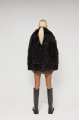 Double-sided curly sheepskin coat in dark chocolate color made of natural sheepskin in OVERSIZE style